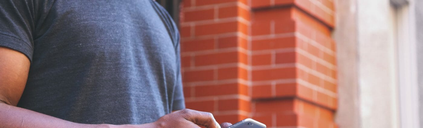 BYOD - Photo of man using phone.