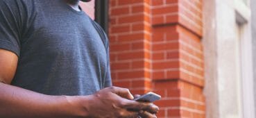 BYOD - Photo of man using phone.