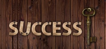 Image of the word success with a key linked to an article on student exam feedback