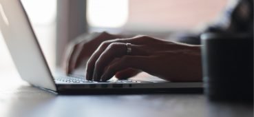 Image of a man typing on a laptop linked to a blog on borderline regression