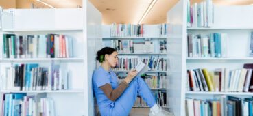 Medical student studying for OSCEs in library